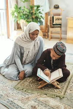 Never value expertise over exploration. a young muslim mother and her son Stock Photos