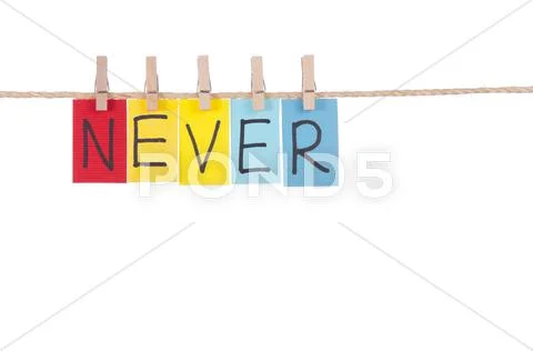 Never, wooden peg and colorful words Stock Photos