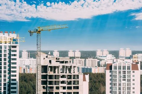 New Accommodation Concept. Amazing Bright Blue Sky Above Construction Crane 스톡 사진