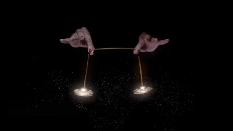 New Age hands ring chimes which creates particles. Stock Footage 102350652