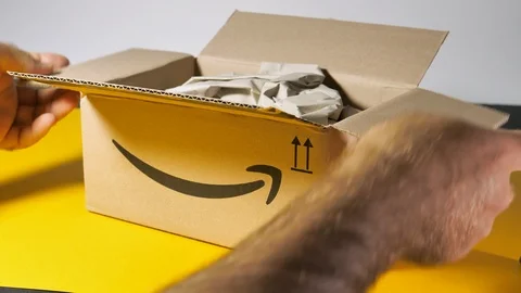 New Amazon Cardboard parcel box containing packaging paper Video stock 117851505