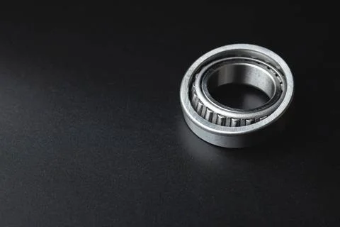 New angular contact roller bearing of a new hub close-up, auto parts on a ... 스톡 사진