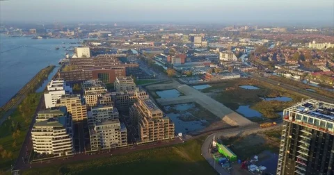 New apartment blocks on reclaimed ground beside open water Vídeo Stock 71296617