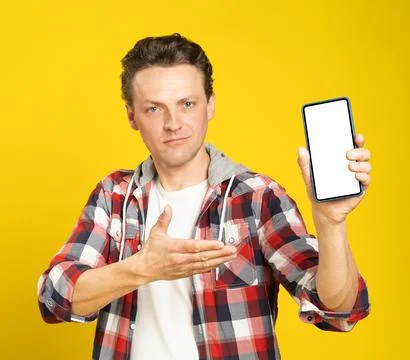 New app or website introduction holding smartphone with white screen blond man Stock Photos