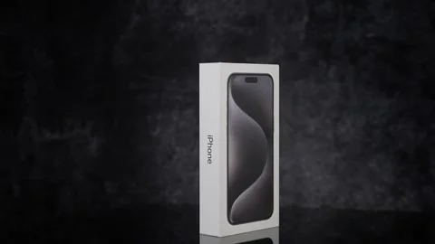 New Apple iPhone 15 Pro Max in a Box on Dark Background - FRANKFURT, GERMANY - Stock Footage 308132623