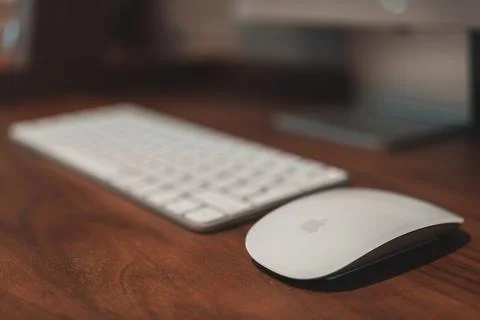 New Apple Magic Mouse compatible with M1 chip Apple devices on a desk at home 写真素材