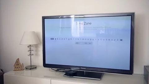 New Apple TV Oled 4k tv with location enabling of ne apple tv Stock Footage 79443710