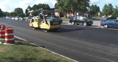 New Asphalt - Compactor Drives by Stock Footage 78556557