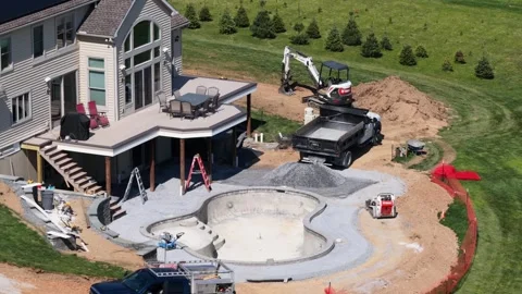 New backyard swimming pool construction at suburban home in United States, with Stock Footage 334602952
