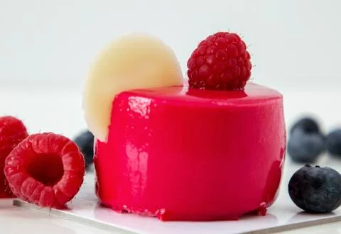 New beautiful stylish red cake with raspberries Stock Photos