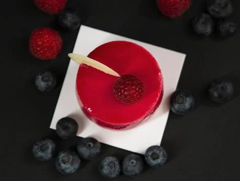 New beautiful stylish red cake with raspberries Stock Photos