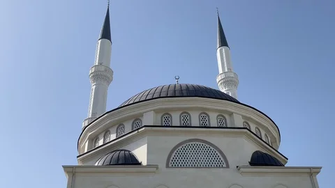 New beautiful white mosque in Turkey with blue sky background. 4k video. Stock Footage 130138225