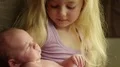 New Big Sister Holds Baby Brother in 4K 4k or 4k+ Resolution