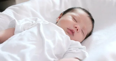 New born baby sleeping on bed Stock Footage 91410863