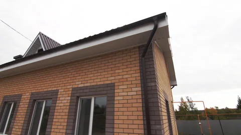 New brick building equipped with modern windows and slate roof 動画素材 293305711
