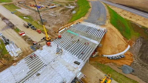 New bridge construction over suburban road. Sky view. Truck repair bridge Stock Footage 78634320