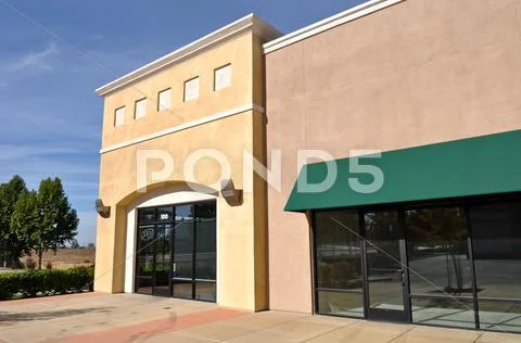 New brown and yellow shopping center store front Stock Photos
