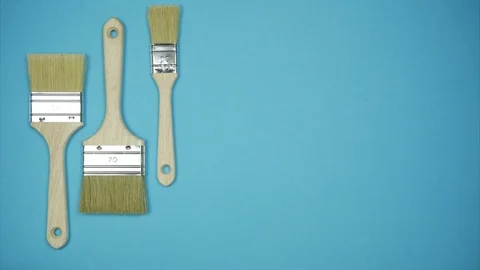 New brushes over light blue background. Stop motion animation Video stock 101808193