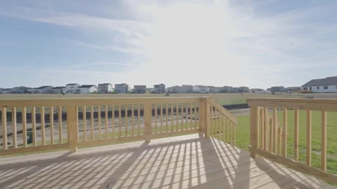 New build house builder grade deck overlooking a new development and cornfield Vídeo Stock 331389848