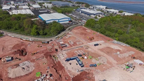 New build housing construction site next to industrial estate, Bromborough Stock Footage 334799972