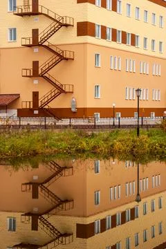 New building and its reflection in the lake Stock Photos
