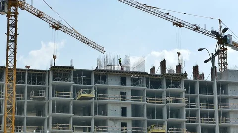 A new building is being constructed with use of tower crane Stock Footage 73622351