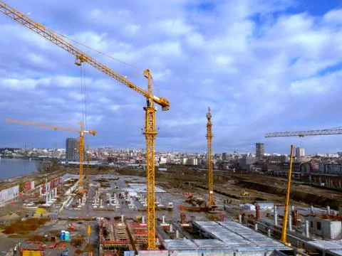 New building is being constructed with use of tower crane Stock Photos