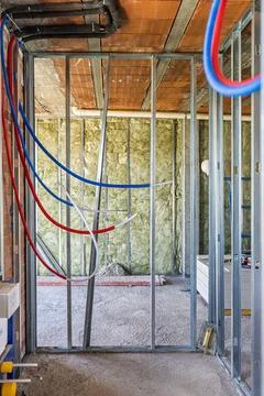 New building construction inside, framing walls and installing pipes 스톡 사진