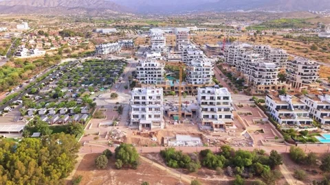 New building development in a large area near a city with several construct.. Stock Footage 340191699