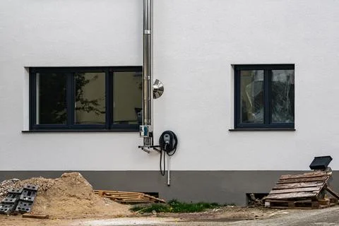 New building showing construction progress and surrounding materials Stock Photos
