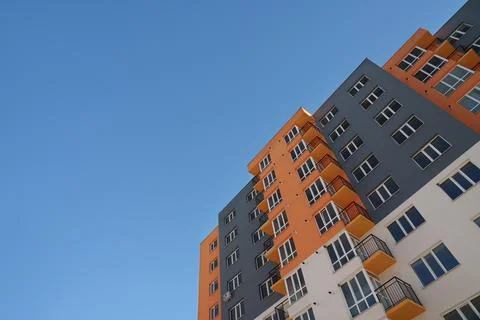 New building Yellow-gray high-rise building. Realtor. Stock Photos