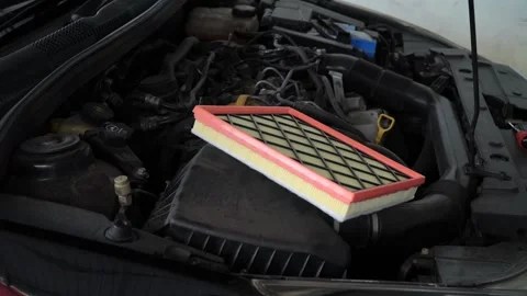 New car air filter in auto maintenance garage.Changing car air filter,Car m.. Stock Footage 282229616