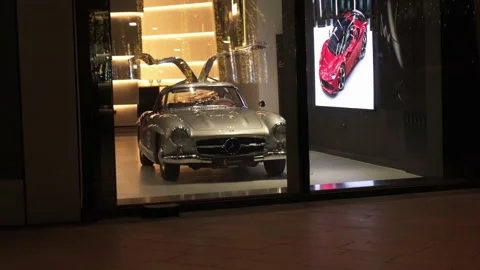 New car behind the window in dubai car salon in dubai Stock Footage 235349554
