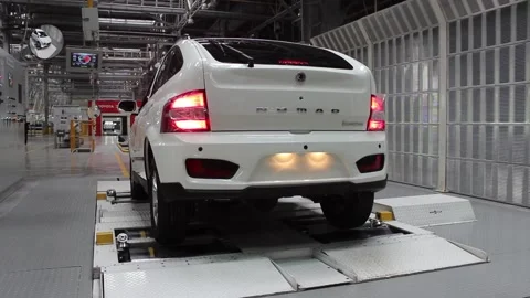 The new car drives off from the test bench at the car factory. Stock Footage 123765664