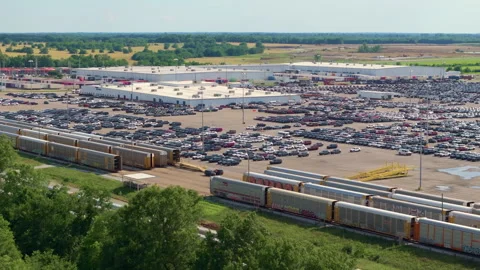 New cars loading on cargo train hauler for worldwide export on automotive Video stock 306278797