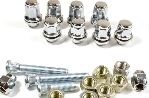 New chrome nuts and studs for repairing different cars Stock Photos
