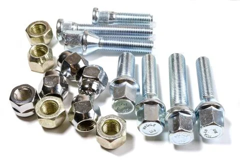 New chrome nuts and studs for repairing different cars Stock Photos