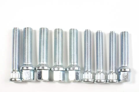 New chrome nuts and studs for repairing different cars Stock Photos