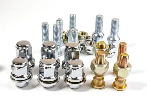 New chrome nuts and studs for repairing different cars Stock Photos