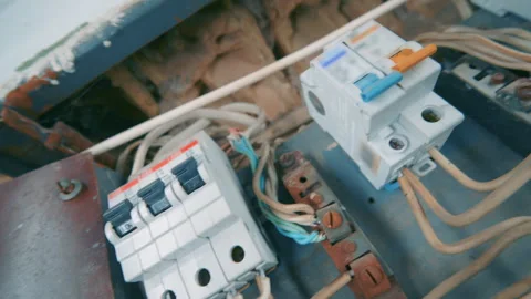 New Circuit Breakers and Relay Installed in Old Rusty Electrical Panel Stock Footage 333722290