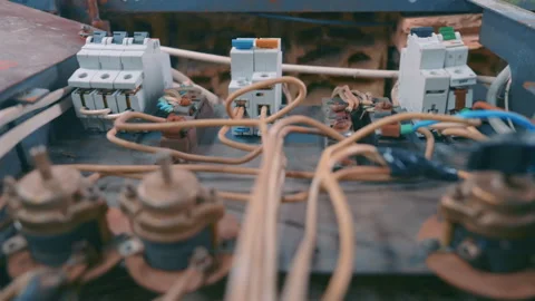 New Circuit Breakers Installed in Old Rusty Electrical Panel | Modern Fuse Box Stock Footage 334810272
