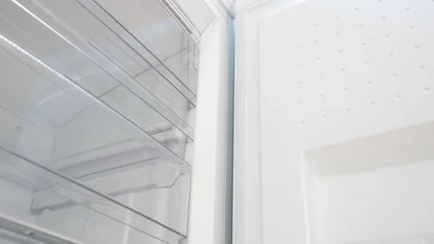 New clean refrigerator. Empty open fridge with shelves Stock Footage 252486216