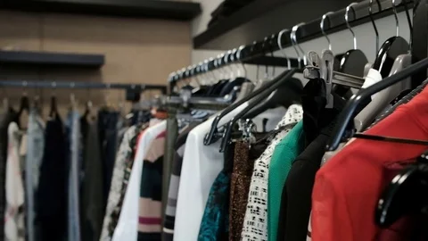 A new collection of clothes entered the store of a famous designer Stock Footage 74702048