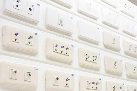 New collection modern toggle white power light switch and electrical outlet.. Stock Photos