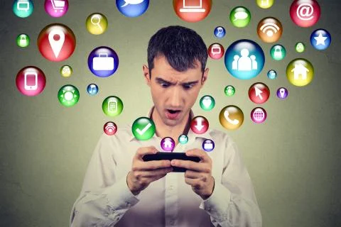 New communication technology mobile high tech concept. Closeup surprised youn Stock Photos