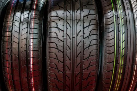 New Compact Vehicles Tires Stack. Winter and Summer Season Tires. Stock Photos