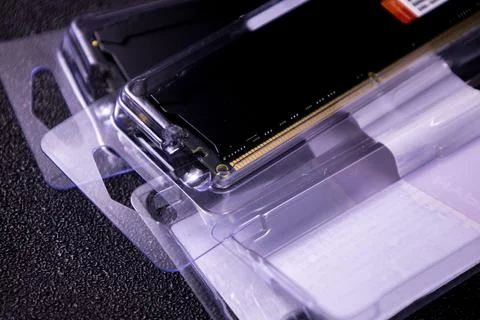 New computer memory modules in clear packaging on a dark surface during evening Stock Photos