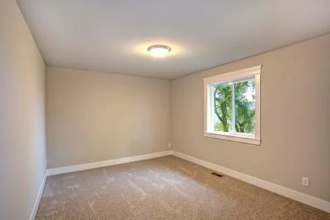 New construction home interior features Empty room with beige walls paint col Stock Photos