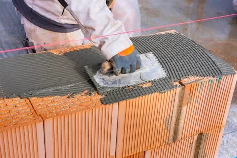 New construction of a house with bricks Stock Photos