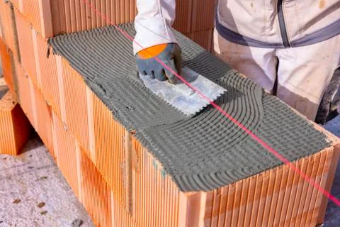 New construction of a house with bricks Stock Photos